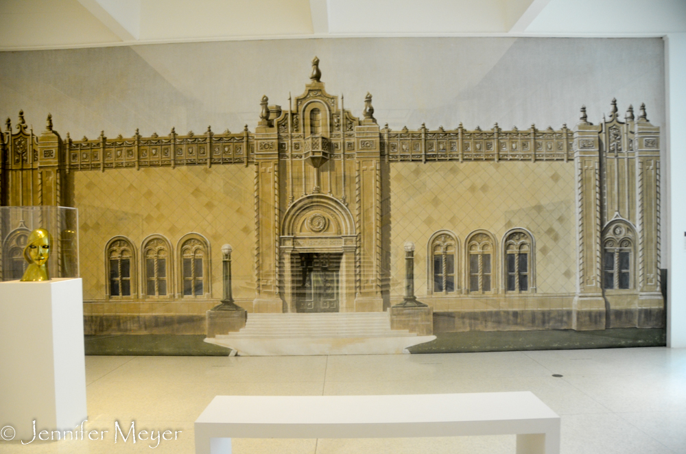 This is a wall hanging, and when you peer through the windows...