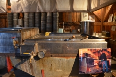 The fire is stoked for days, until the sap evaporates to syrup.