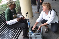 Kate talks to a young man collecting money for a battered women's shelter.