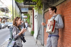 Beth chats with an accordionist.