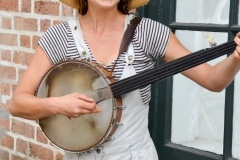This cute musician tap danced while she sang and played the banjo.