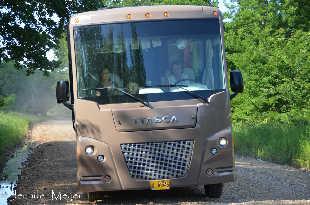 Driving Bessie down the gravel road near our property.