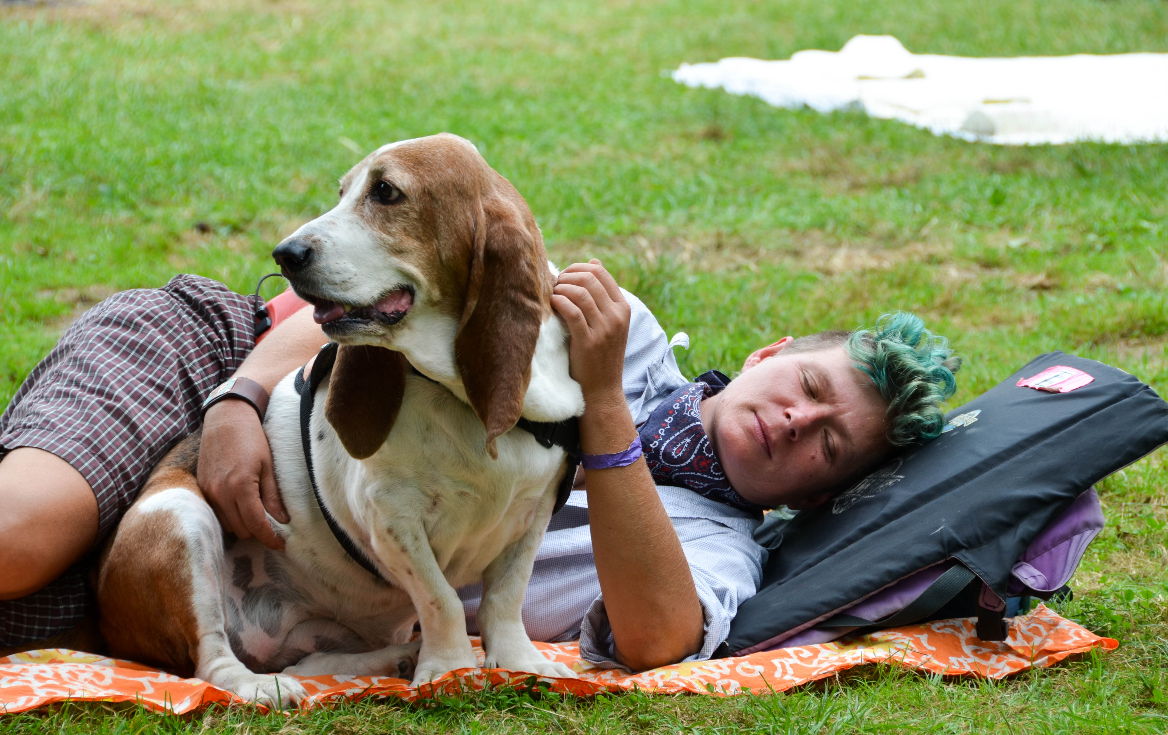 Festival goer rests with her pal.