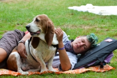 Festival goer rests with her pal.