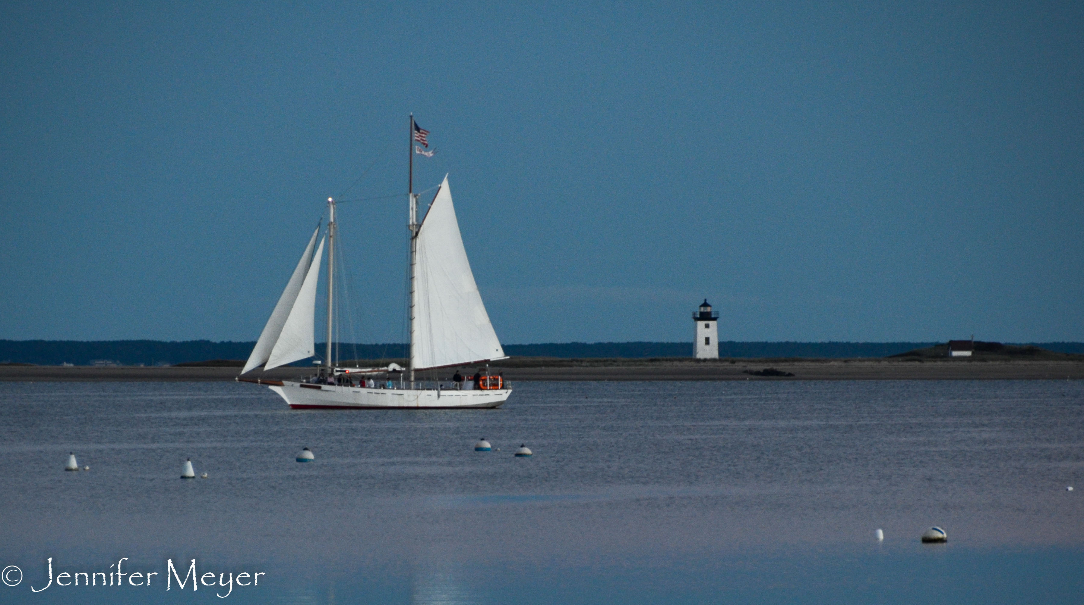 The sunset sail returns to the dock.
