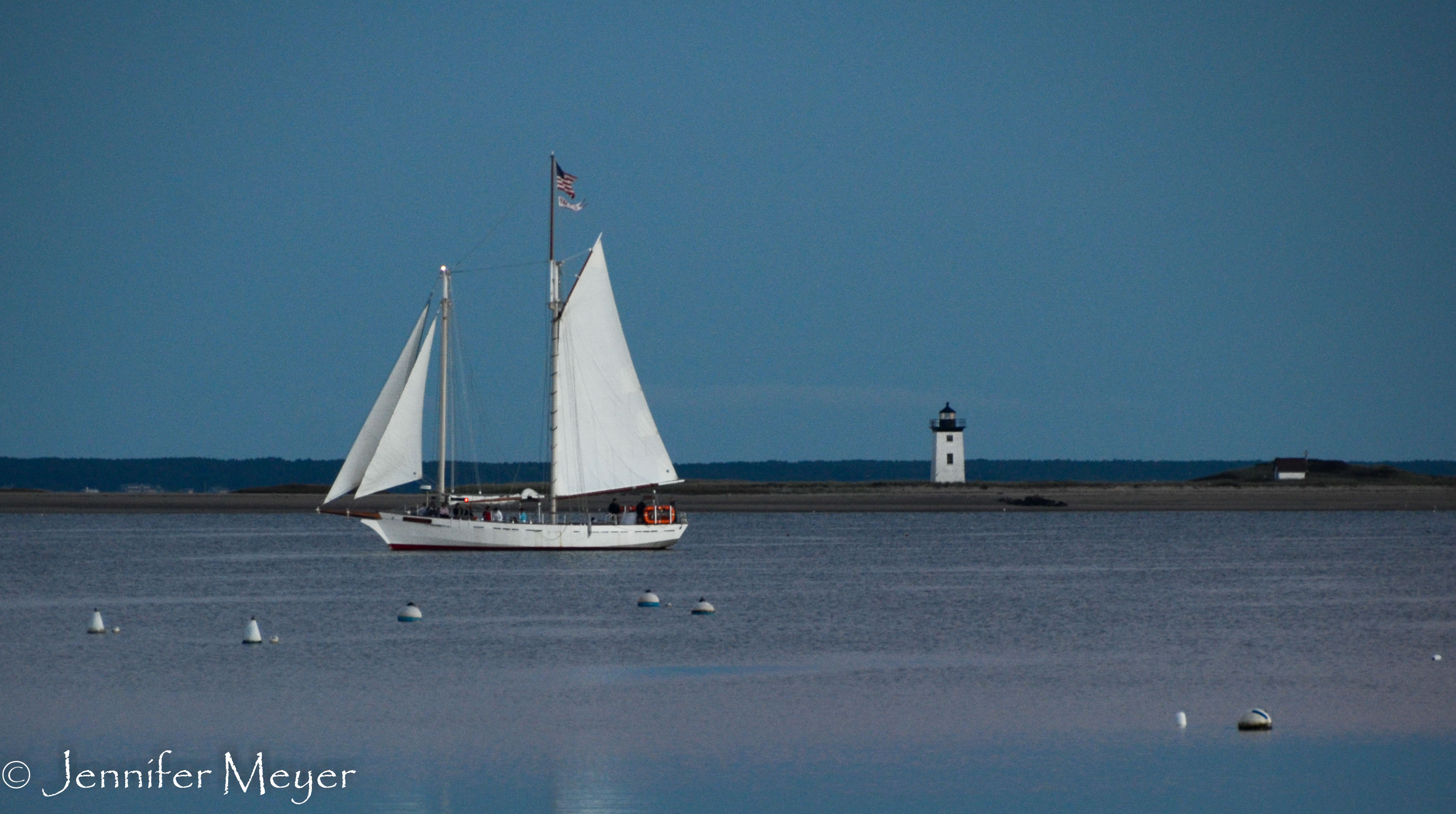 The sunset sail returns to the dock.