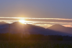 The sun sets into the Adirondack mountains.