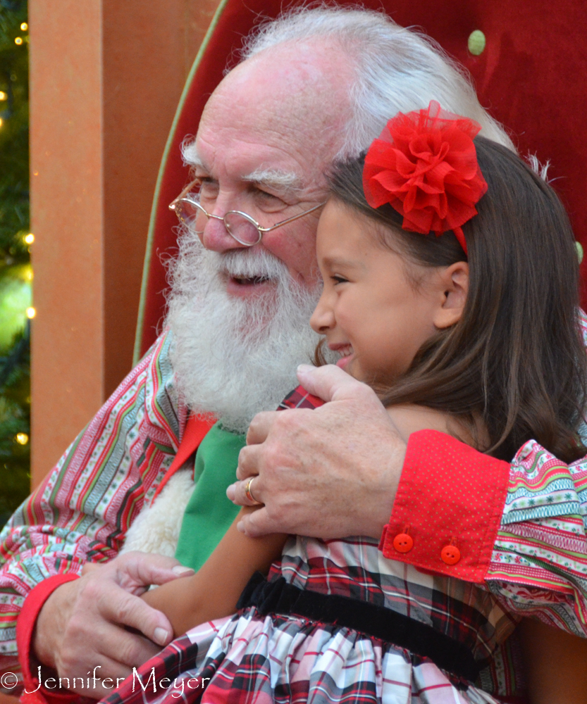 Santa gets a hug.