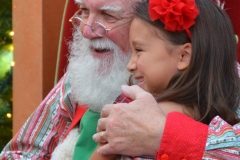 Santa gets a hug.
