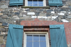 Shutters on waterfront building.