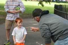 A trumpeter interacts with a young fan.