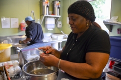 The owner, peeling shrimp.