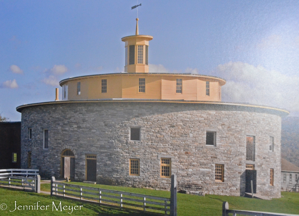 Photo of a round barn in another vilage. Shakers invented the round barn.