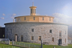 Photo of a round barn in another vilage. Shakers invented the round barn.