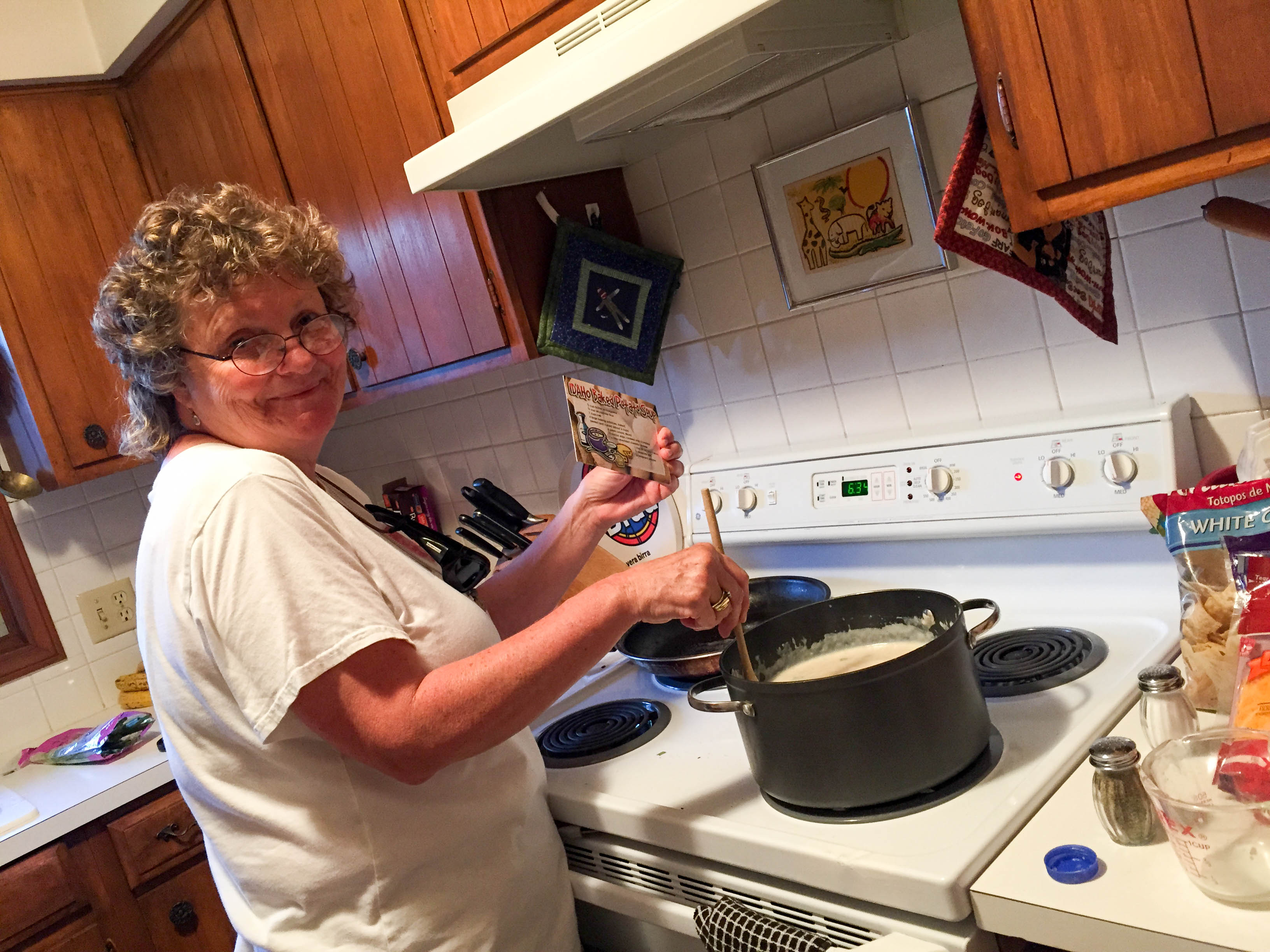 Kate making a potato soup recipe my older brother sent.