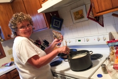 Kate making a potato soup recipe my older brother sent.