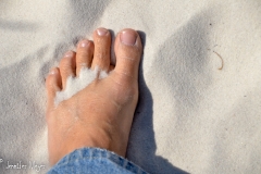 Soft sand warm on my feet.