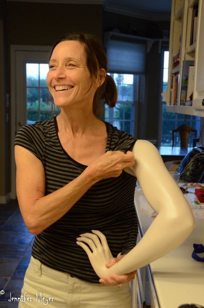 Beth shows off her new mannequin arm: an antique store impulse.
