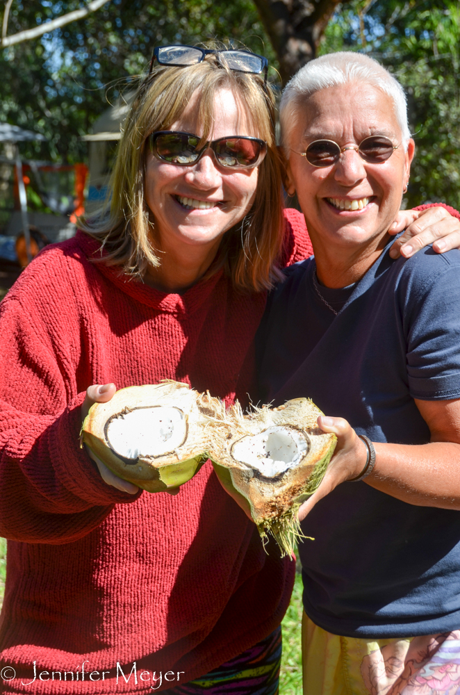 Tammy and Renny share a coconut.