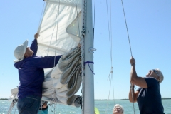 Hoisting the sail.