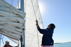 Hoisting the sails back up.