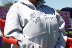 Beth hides inside her sweatshirt.