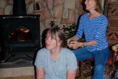 Mom braids Heidi's hair.