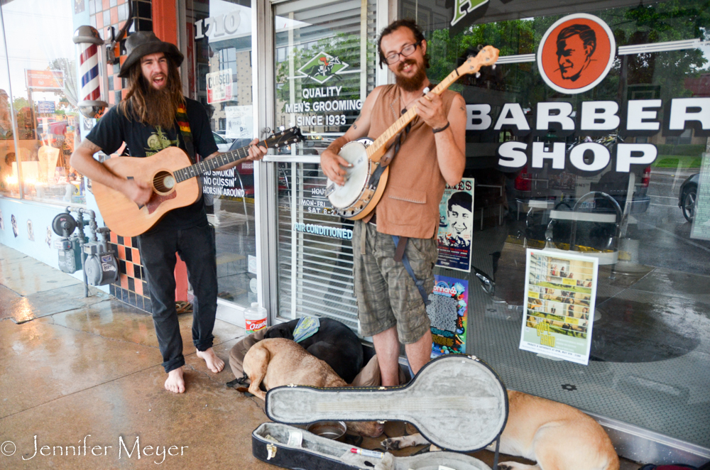 The rain wasn't bothering these musicians and their three dogs.