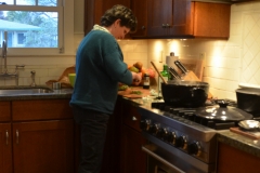 Angelica making pozole with her sous chef, Izzie.