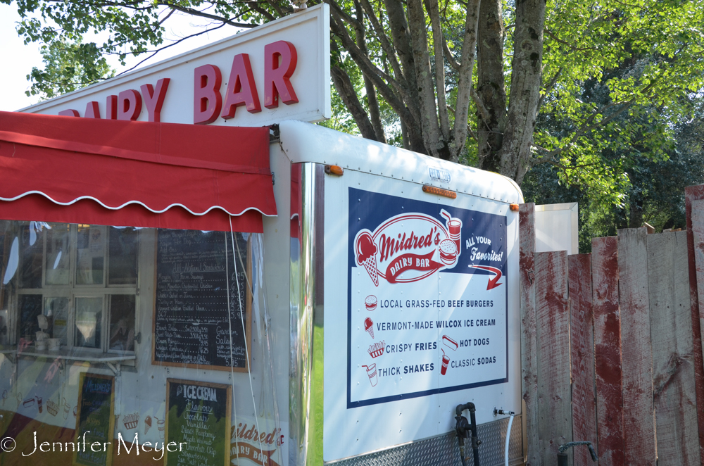 A food cart in front of the store.