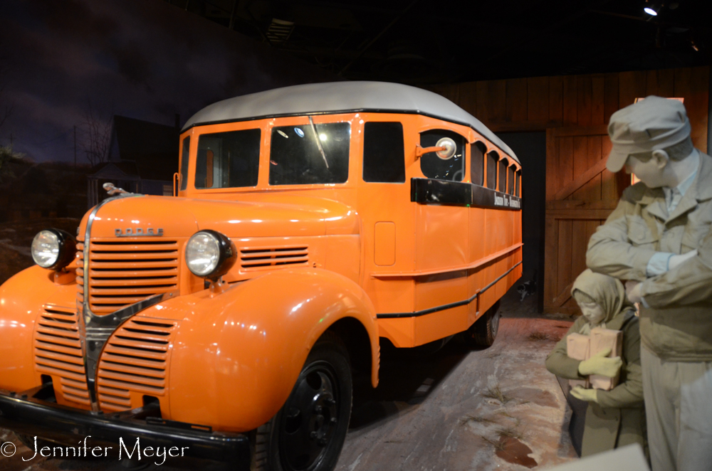 This little girl doesn't look happy about taking the bus.