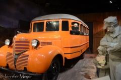 This little girl doesn't look happy about taking the bus.
