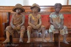 Sculptures by Woodrow Nash haunt the church on the plantation property.