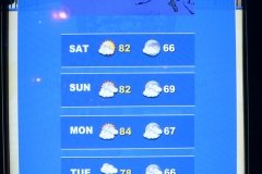 A kiosk brags about the weather.