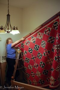 Down comes Kate's grandma's quilt.