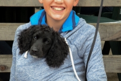 Cute kid with his puppy.