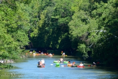 A giant group going down river together.
