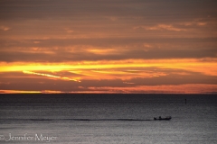Fishing boat heading out.