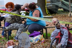 A mom paints her kids' faces.