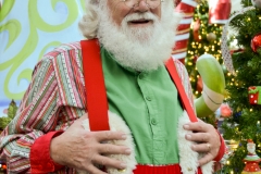 Santa pauses before taking his seat.