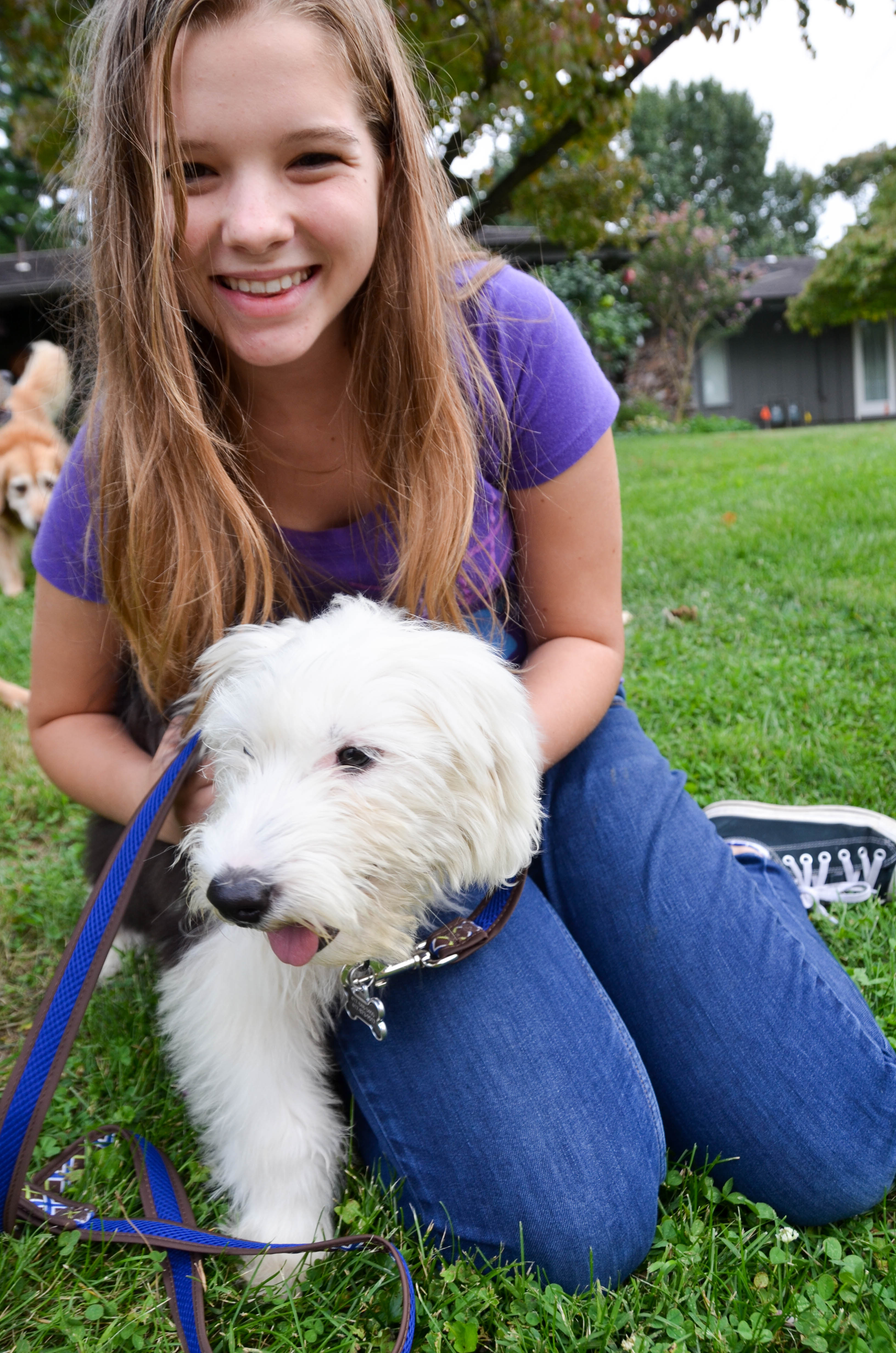 Sharon's granddaughter and her new puppy, Winnie.