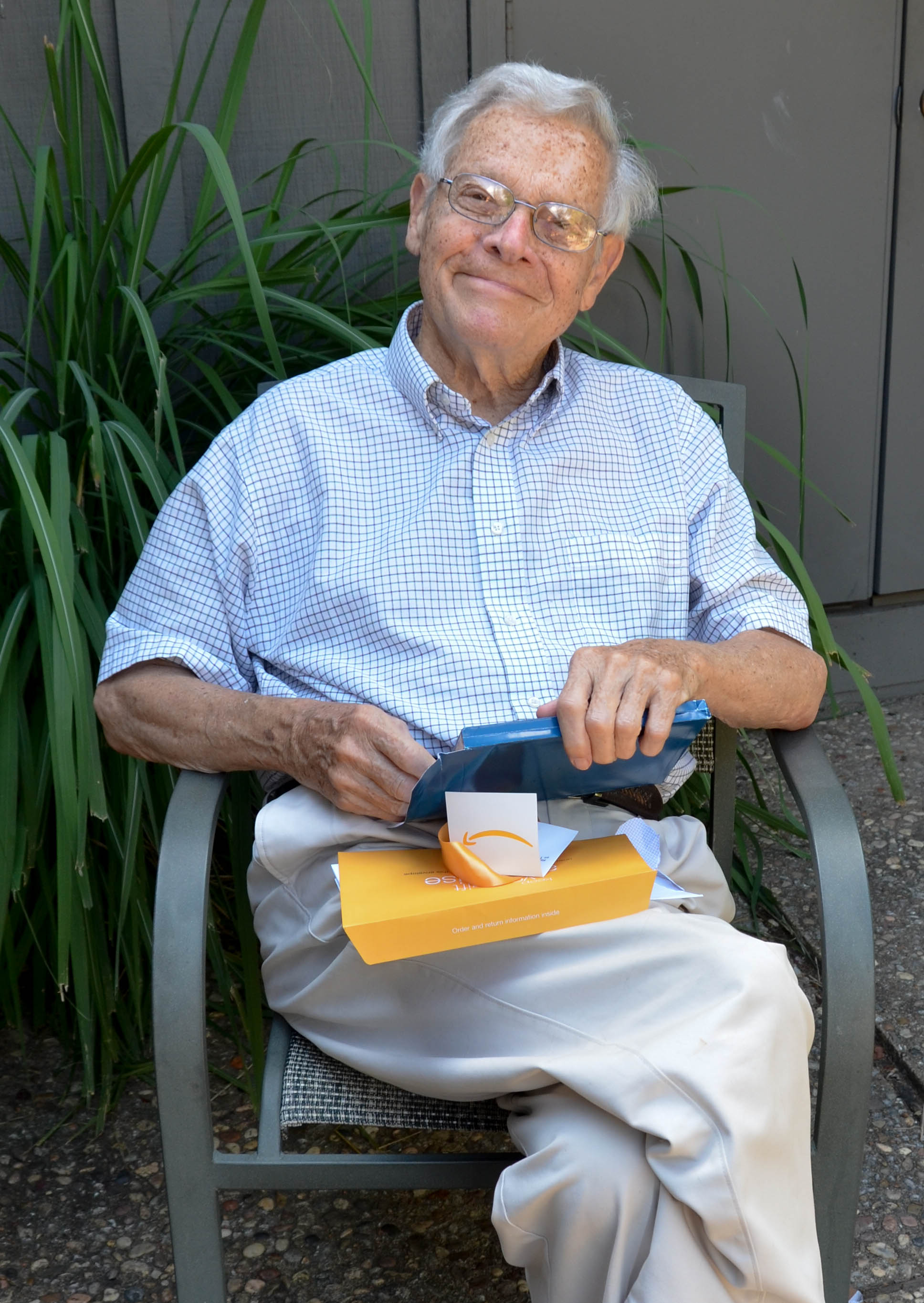 Dad opens a present that arrived from my sister.