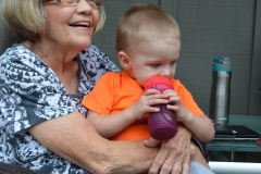 Neighbor, Willie, holds Josh.