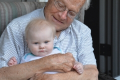 Dad held baby Promise.