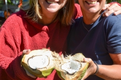 Tammy and Renny share a coconut.