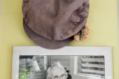 One of the founder's photo and hat.