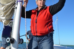 Glo helps with the sails.